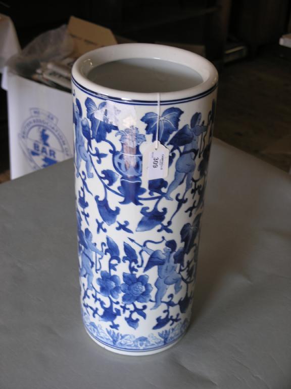 Appraisal: A Chinese porcelain stick stand cylindrical shape painted with foliage