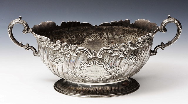 Appraisal: A LATE VICTORIAN SILVER ROSE BOWL oval shaped with scroll