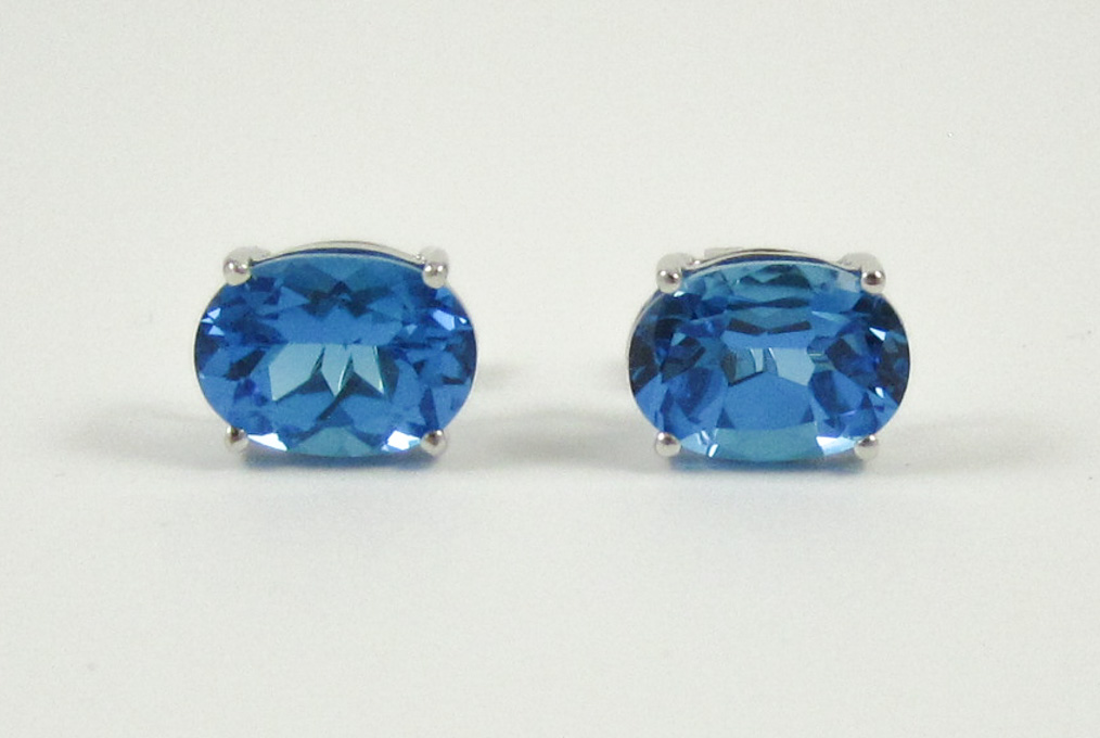 Appraisal: PAIR OF BLUE TOPAZ AND WHITE GOLD EAR STUDS each