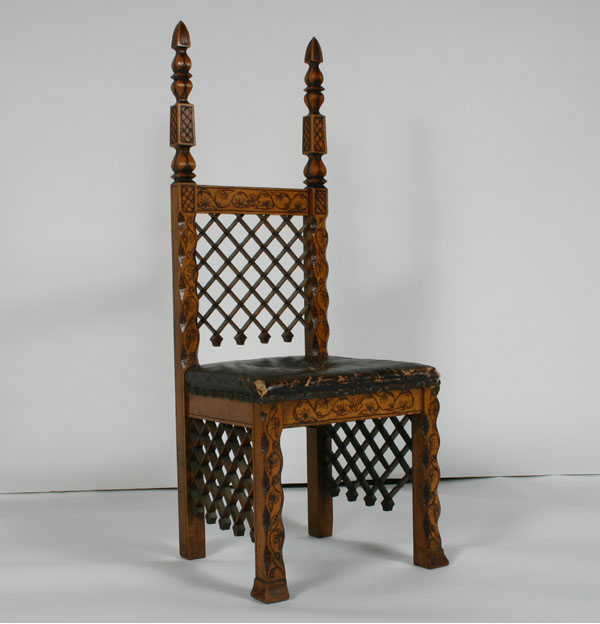 Appraisal: Pyrography folk art chair honeycomb grid back and stretchers leather