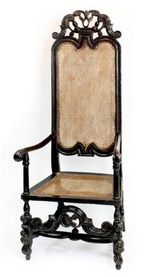 Appraisal: A William and Mary ebonised beech high back cane armchair