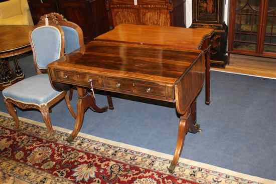 Appraisal: A Regency brass inlaid rosewood sofa table with burr yew