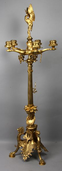 Appraisal: French-style bronze candelabra having figural bird finial and griffin medallion