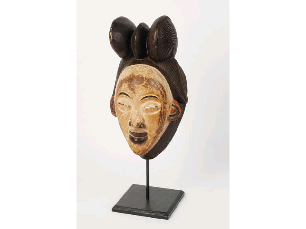 Appraisal: A CARVED AFRICAN PUNU MASK of a female head with