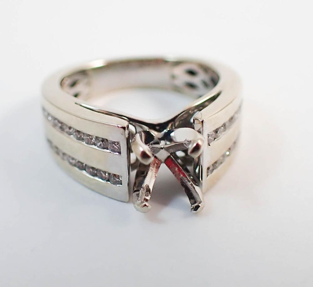 Appraisal: DIAMOND AND FOURTEEN KARAT WHITE GOLD SEMI-MOUNT RING Each side