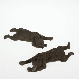 Appraisal: Near pair Russian bronze models of sleeping bears Late th