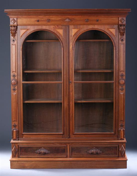 Appraisal: VICTORIAN WALNUT LIBRARY BOOKCASE TWO PIECES Projecting molded-edge crown over