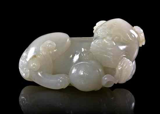 Appraisal: A White Jade Carving of a Lion depicted having a