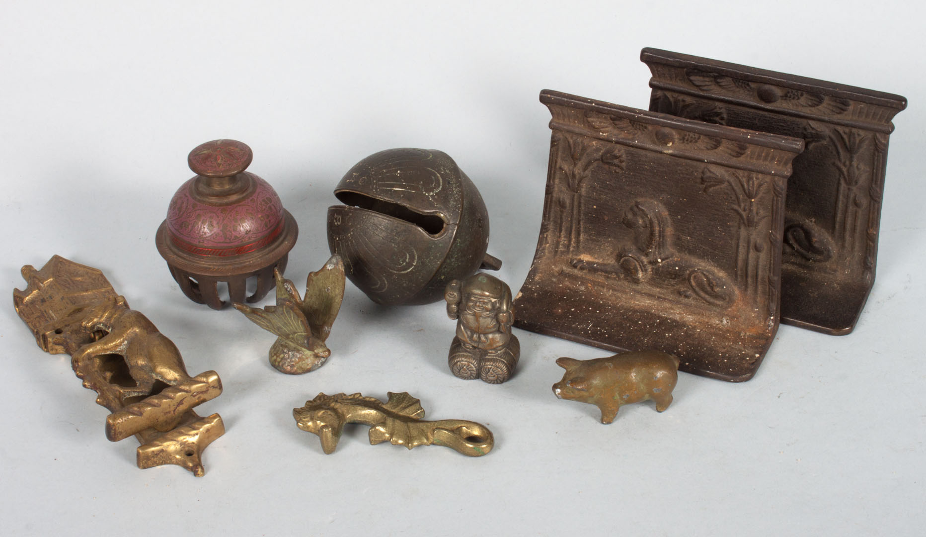 Appraisal: Nine assorted brass and cast iron objects including pair of