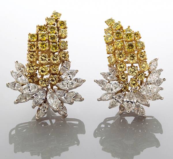 Appraisal: A pair of diamond and colored diamond earclips in the