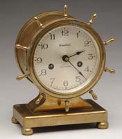 Appraisal: WATERBURY BRASS SHIP S CLOCK Case with ship s wheel