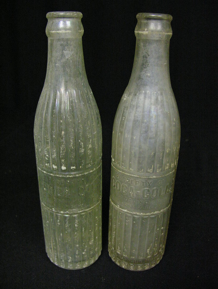 Appraisal: TWO EARLY COCO-COLA COKE BOTTLES Clear ribbed Property of Coco-Cola