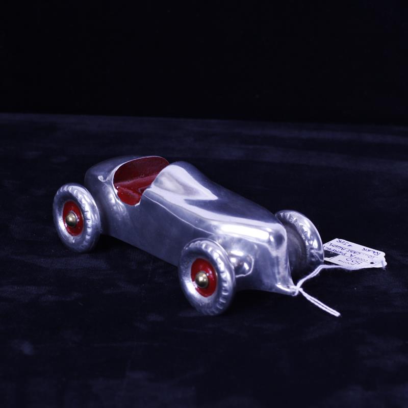 Appraisal: Cast Aluminum Racer Race Car with red paint accents Maker