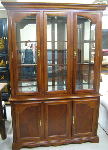 Appraisal: QUEEN ANNE STYLE CHINA DISPLAY CABINET ON CABINET manufactured The