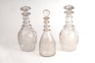 Appraisal: A pair of cut glass triple-ring neck decanters and stoppers