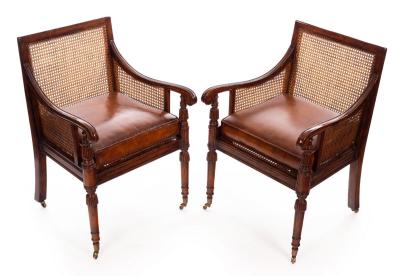 Appraisal: A pair of Regency style walnut berg re armchairs by