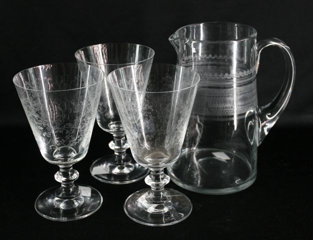 Appraisal: A Pall Mall jug with engraved decoration together with three