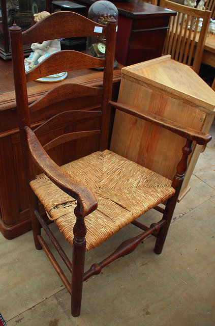 Appraisal: A VICTORIAN LATH BACK WINSOR OPEN ARMCHAIR with turned legs