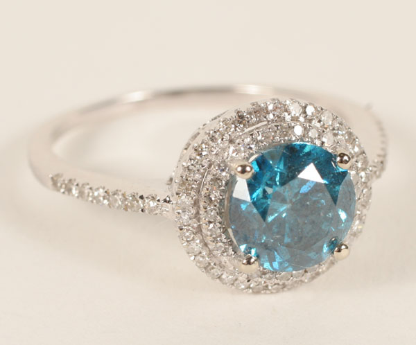 Appraisal: White gold K ct blue diamond ring with round diamond