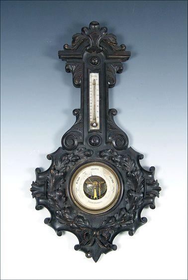 Appraisal: BLACK FOREST CARVED BAROMETER Aneroid barometer thermometer with Farenheit Celcius