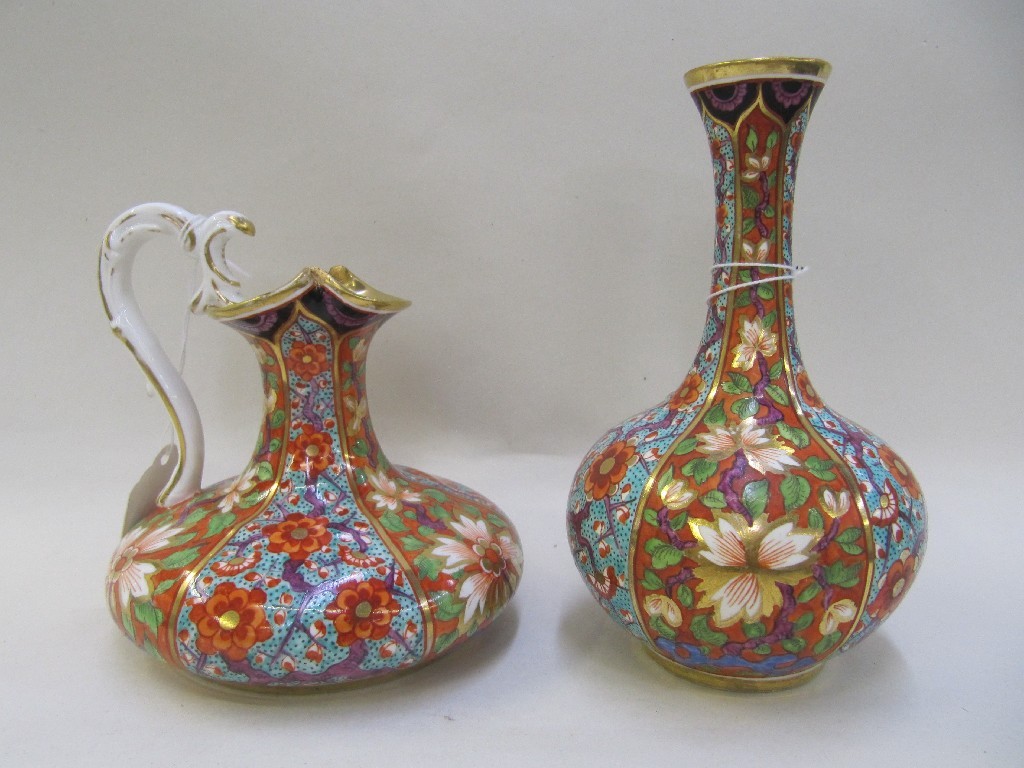 Appraisal: Derby porcelain jug and matching vase painted with panels of