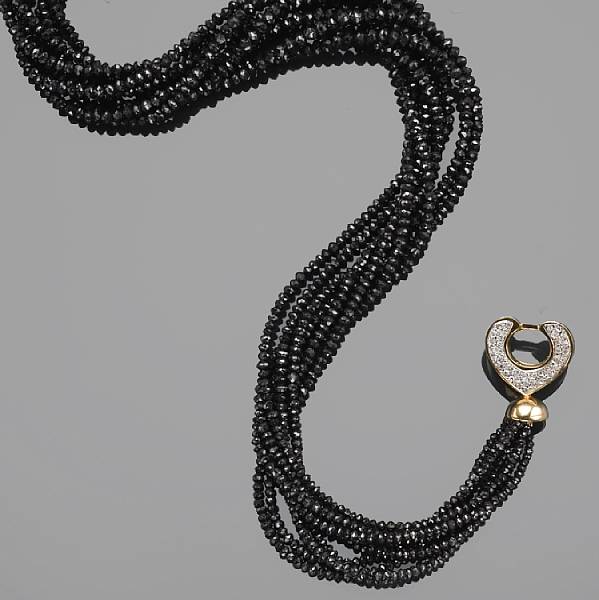 Appraisal: A black diamond diamond and k gold torsade necklace estimated