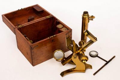 Appraisal: A small gilt brass microscope in fitted wooden case and