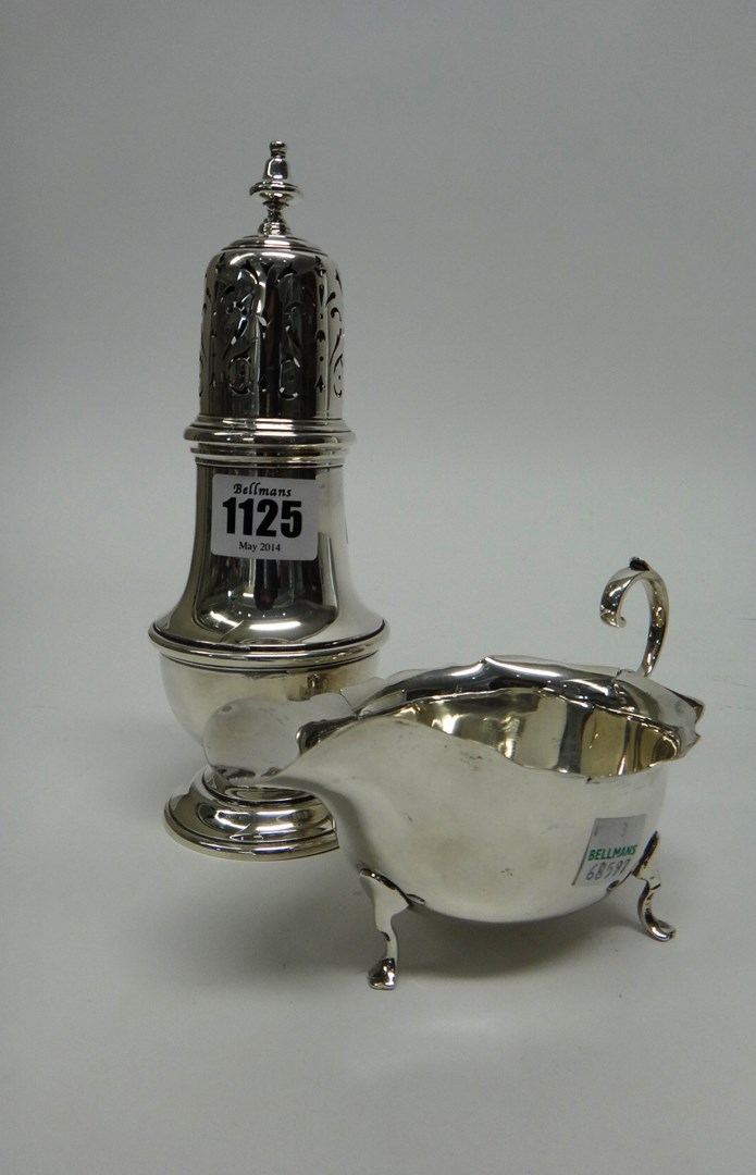 Appraisal: A silver baluster shaped sugar caster London and a silver