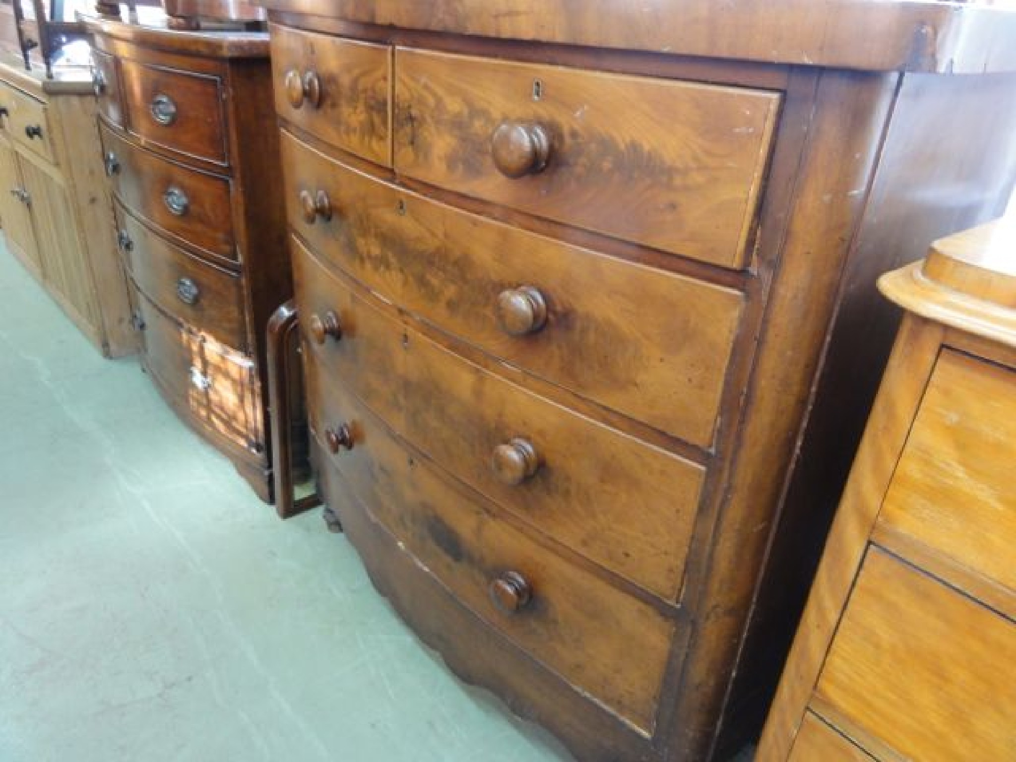 Appraisal: A Victorian mahogany bow fronted bedroom chest of three long