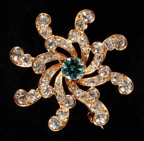 Appraisal: Diamond and blue zircon starburst pendant-brooch set in K yellow