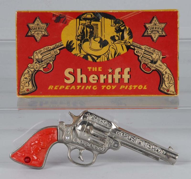 Appraisal: Cast Iron Stevens Sheriff Cap Gun Description Red grips are