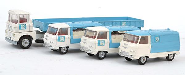 Appraisal: FOUR CORGI CO-OP COMMERCIAL VEHICLES INCLUDING ARTICULATED TRAILER X MILK