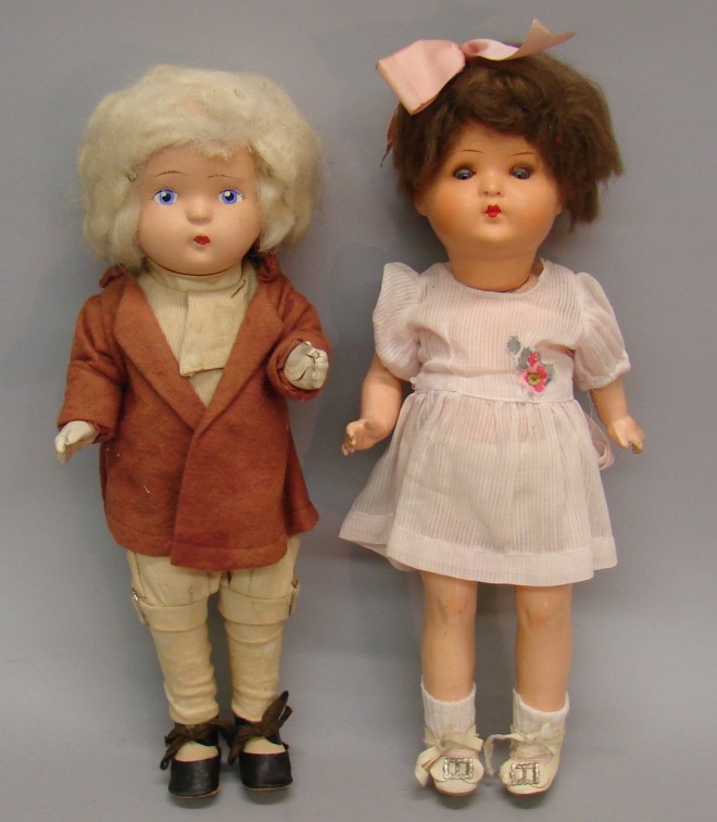 Appraisal: Pair of dolls Germany A doll with blue sleep eyes