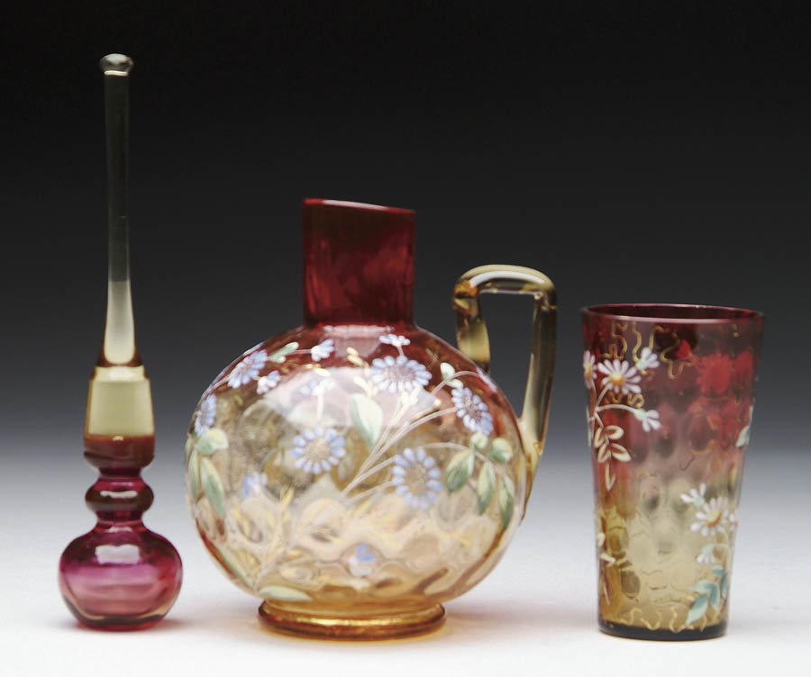 Appraisal: THREE PIECES OF AMBERINA Decorated Amberina cruet Cruet has inverted