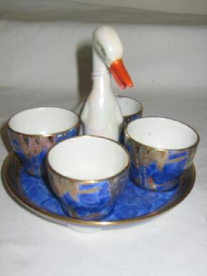 Appraisal: A CARLTON WARE EGG CRUET the four egg cups gilded