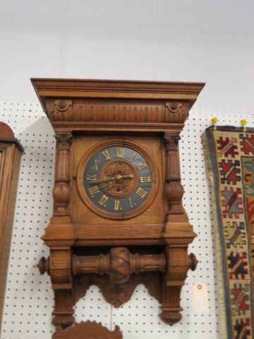 Appraisal: Carved Oak Wall Clock elaborate case side pull Roman numeral