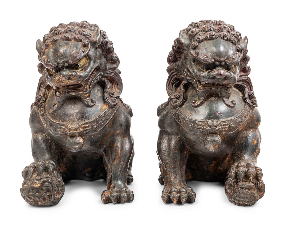 Appraisal: A Pair of Chinese Bronze Fu Lions A Pair of