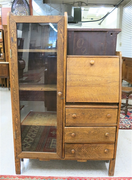 Appraisal: AN OAK SECRETARY BOOKCASE American c the left half a