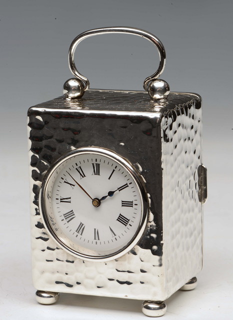 Appraisal: AN EDWARDIAN SILVER CARRIAGE TIMEPIECE having a circular white enamel