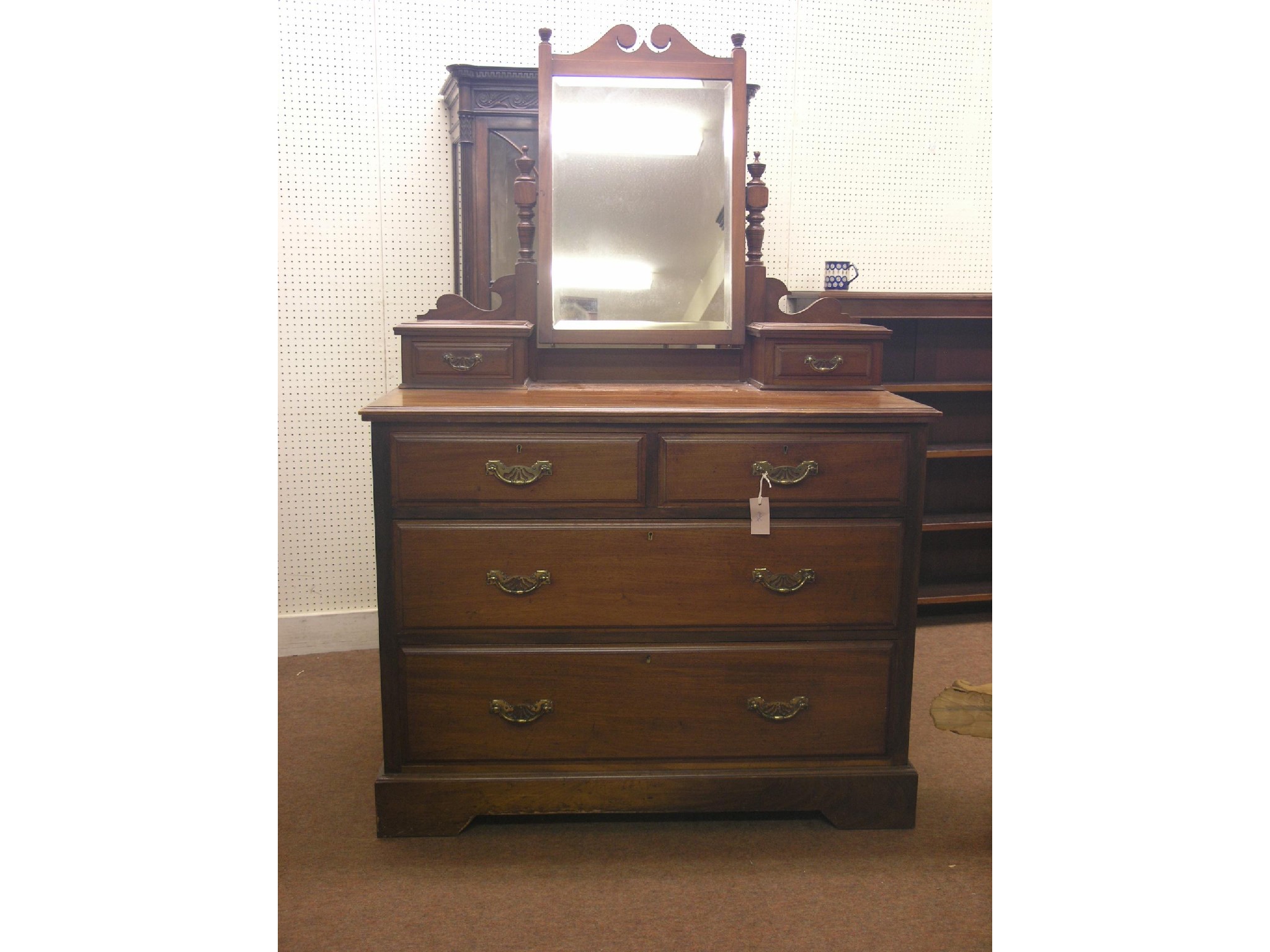 Appraisal: A late Victorian mahogany dressing chest adjustable mirror above two