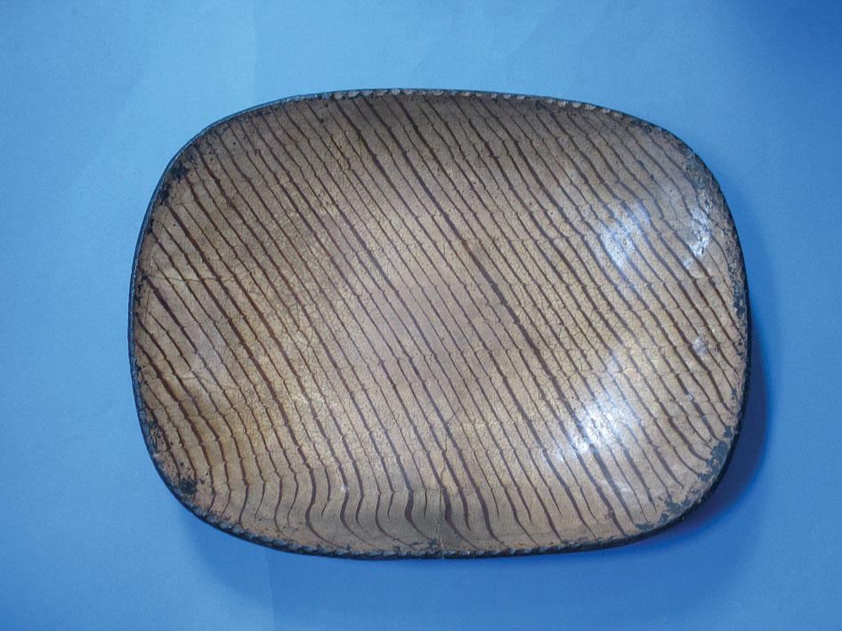 Appraisal: A STAFFORDSHIRE SLIPWARE PLATTER of rounded rectangular form with coned