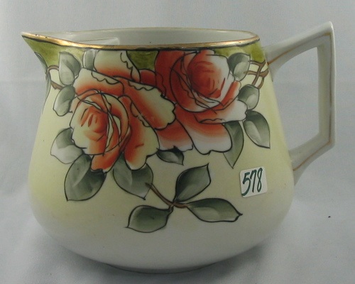 Appraisal: A NIPPON PORCELAIN CIDER PITCHER hand painted orange flower on