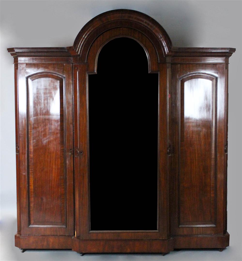 Appraisal: WILLIAM IV MAHOGANY WARDROBE heavily molded domed cornice above a