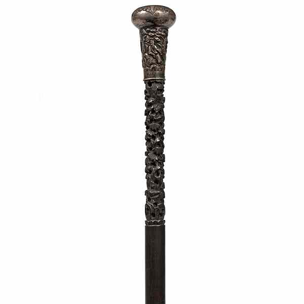 Appraisal: Chinese Carved Cane Chinese a cane with metal head the