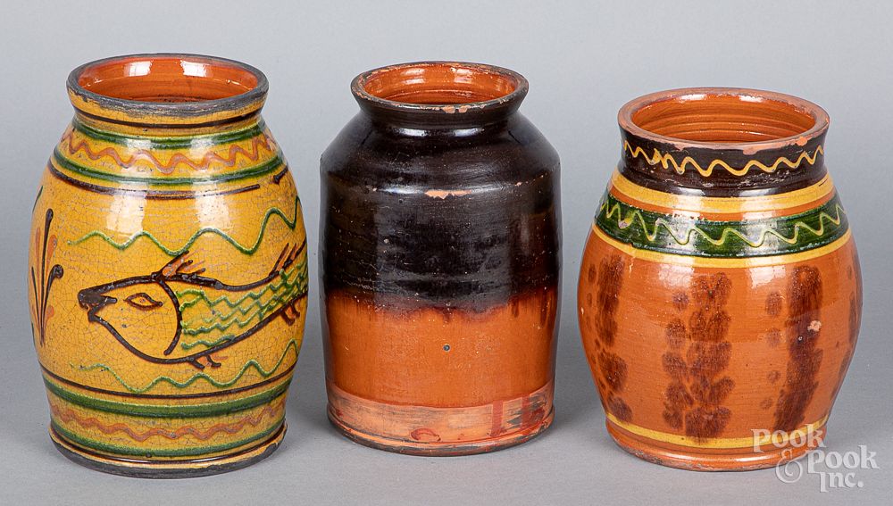 Appraisal: Three Shooner redware jars Three Shooner redware jars tallest -