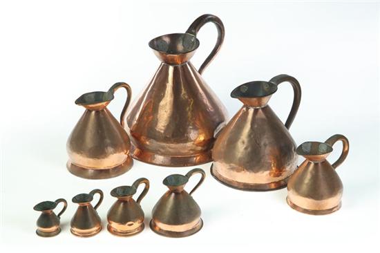 Appraisal: SET OF EIGHT MEASURES England th century copper Graduated haystack