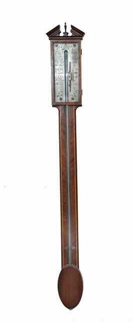 Appraisal: A GEORGIAN STYLE MAHOGANY STICK BAROMETER with rectangular silvered scale