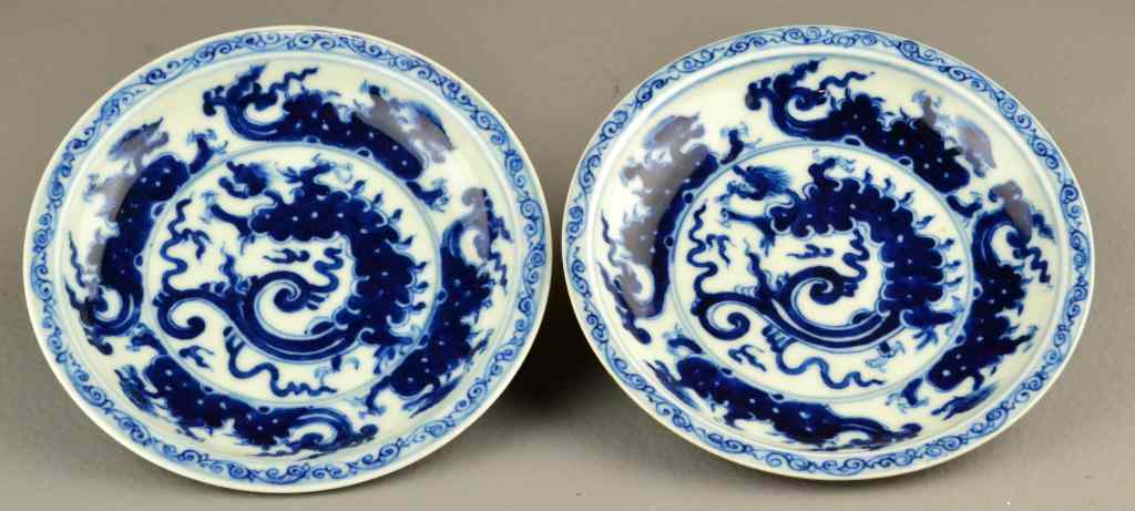 Appraisal: Pr Chinese Blue White Porcelain Saucer DishesInterior finely painted to