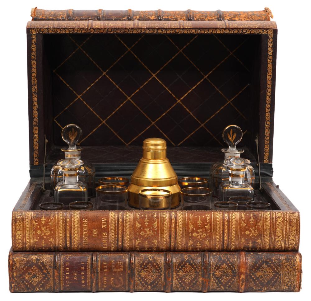 Appraisal: LARGE FRENCH LEATHER-BOUND BOOK TANTALUS SETLarge French Tantalus set housed