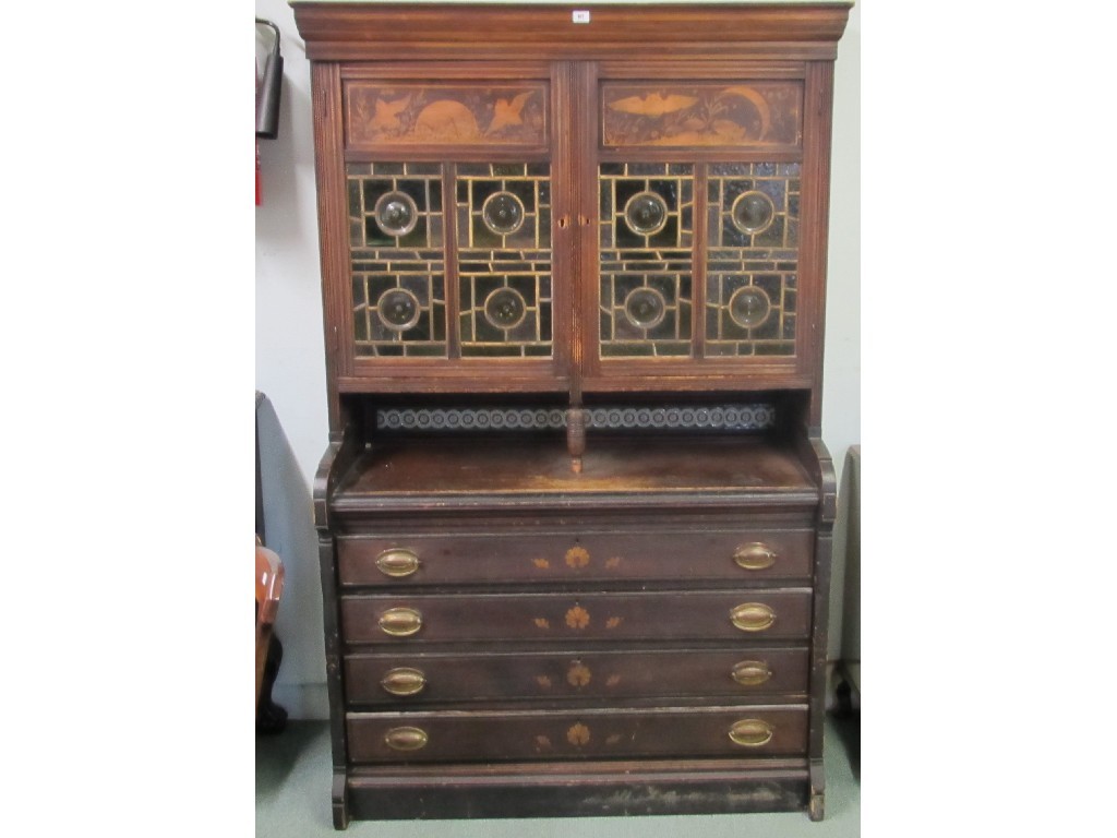 Appraisal: Victorian Aesthetic Movement cupboard on chest with penwork panels